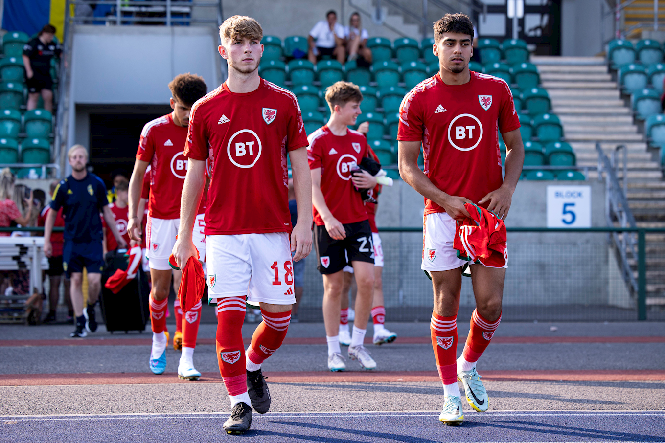 Jonathan Bland walks out with his Wales U19s teammates
