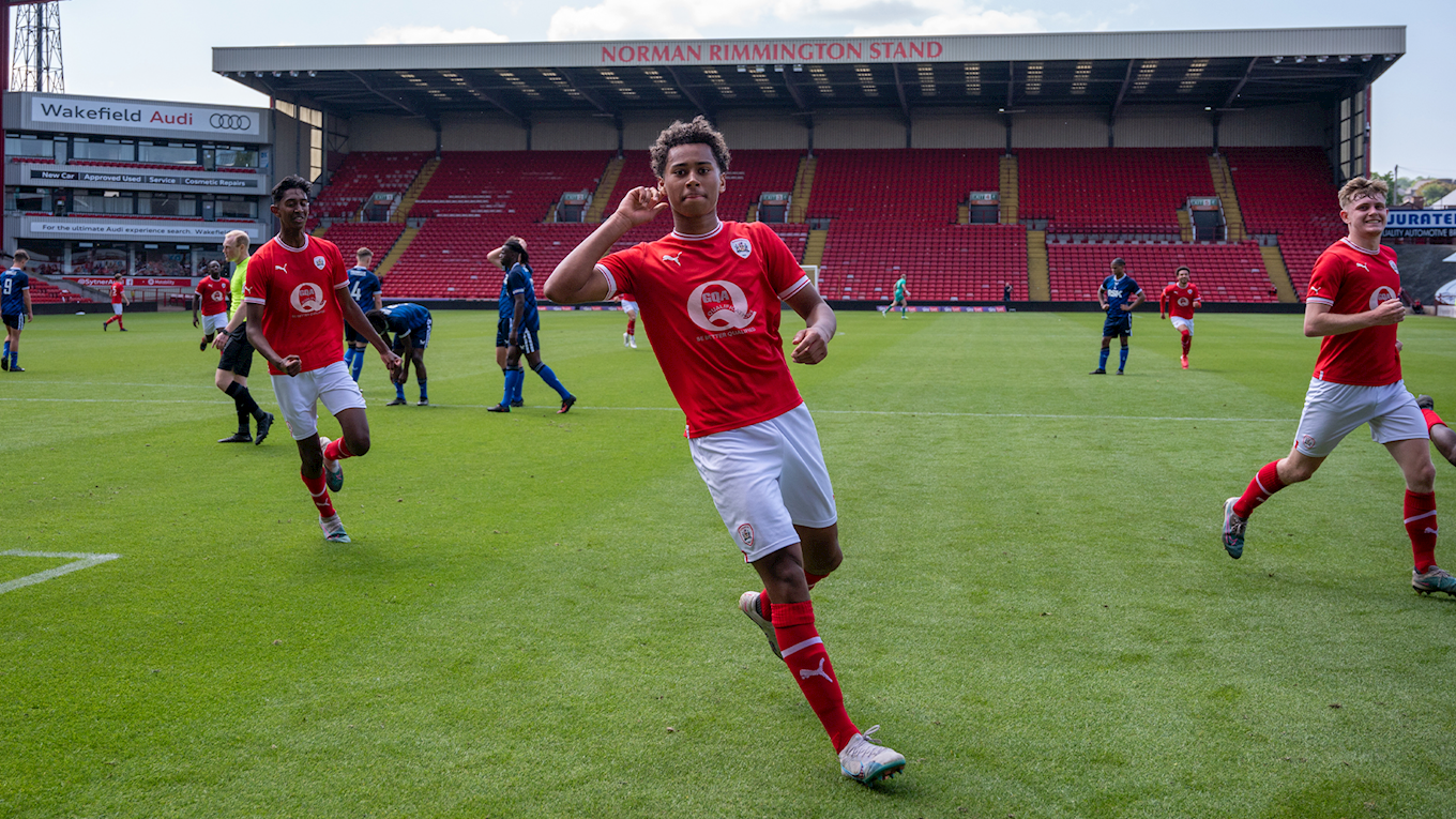 Theo Chapman celebrates after netting his penalty against Charlton Athletic